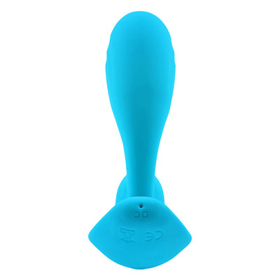 Blue silicone wearable with bulbous shaft and wide curved base shown from above on white background.