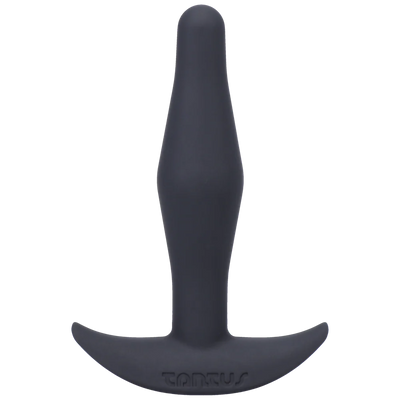 Small black silicone butt plug with a tapered tip and curved base for secure, comfortable wear.
