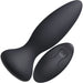 Black silicone rechargeable anal plug with wide base and matching wireless remote control.