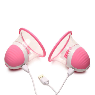Pair of pink rotating silicone nipple suckers with USB charging cables on a white background.