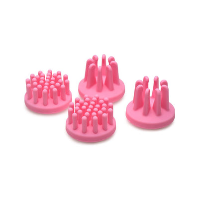 Set of four pink silicone rotating nipple sucker attachments with varied nub shapes for targeted stimulation.