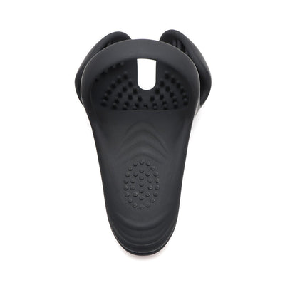 Black silicone vibrating cock ring with textured taint stimulator and flexible design shown from above on white background.