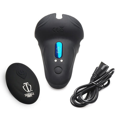 Black vibrating silicone cock ring with remote control and USB charging cable on white background.