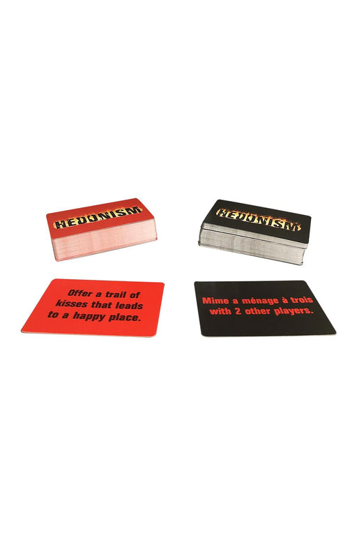 Two stacked decks of Hedonism card game with example red and black cards displaying playful adult challenges.