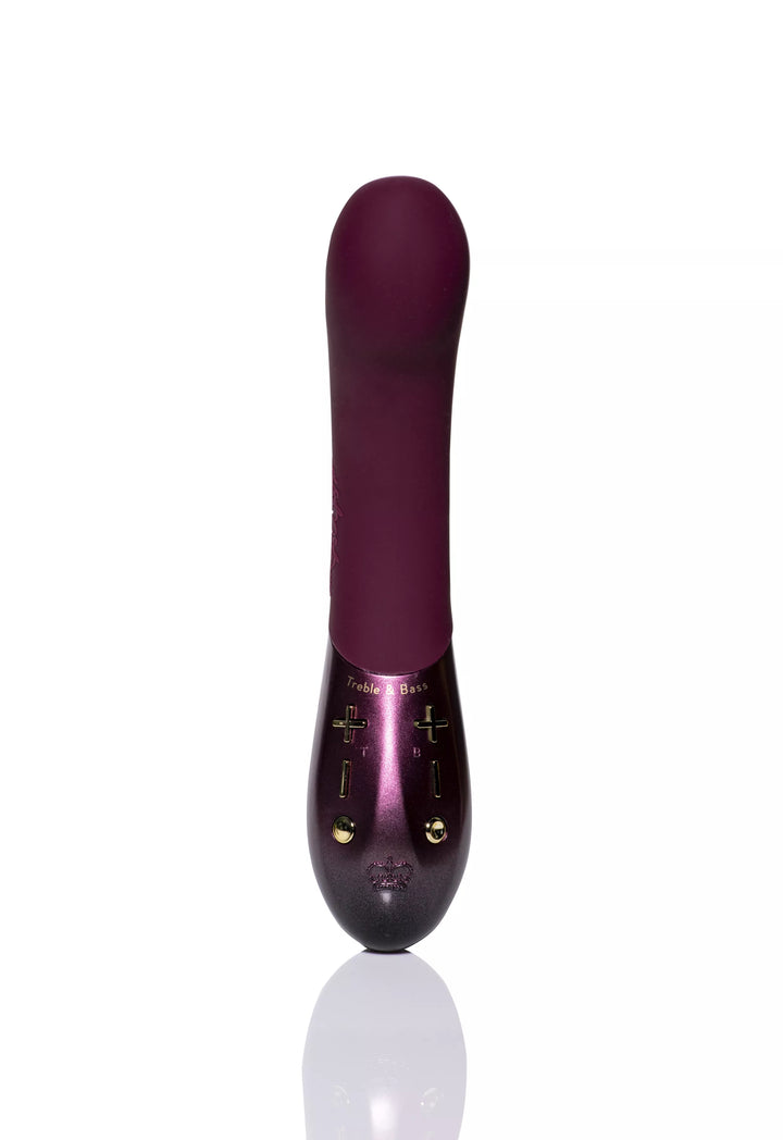Plum-colored Hot Octopuss Kurve G-spot vibrator with ergonomic shape and dual motor controls on a reflective surface.