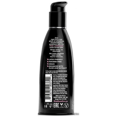 Black pump bottle of Wicked Aqua water-based lubricant with product details and usage instructions on the back label.