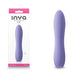 Compact lavender silicone Inya Ruse rechargeable vibrator with sleek, curved design shown with packaging.