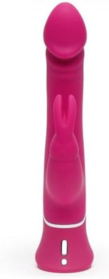 Pink dual-density silicone rabbit vibrator with curved tip and clitoral stimulator ears.