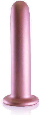 Rose gold smooth silicone G-spot dildo with strong suction cup base, 7 inches long.