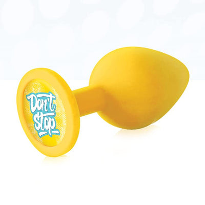 Yellow silicone butt plug with "Don't Stop" text on the base, designed for playful adult fun.