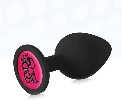 Black silicone butt plug with a pink base featuring "Bad Girl" text in graffiti style.