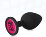 Black silicone butt plug with a pink base featuring "Bad Girl" text in graffiti style.