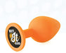 Orange silicone butt plug with a round base featuring the phrase Hit It Hard in bold text.