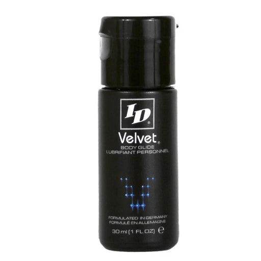 Small black bottle of ID Velvet silicone body glide lubricant with blue molecular design and flip-top cap.