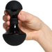 Hand holding a black Vive Enoki bendable massager with textured silicone base and smooth ABS handle.