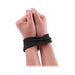 Hands bound together with black silk rope from Fetish Fantasy Series, showcasing soft, secure bondage material.