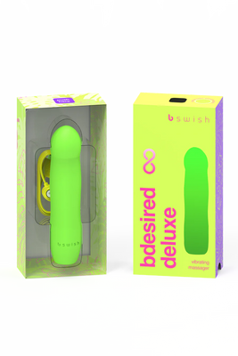 Bright green B Swish Bdesired Infinite Deluxe vibrating massager with USB charging cable, displayed alongside its matching packaging box.