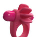 Pink 4B Skooch vibrating cock ring with fin-like extensions and dual bullet vibrators made of flexible silicone and ABS plastic.