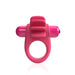 Pink vibrating cock ring with textured fins and removable bullet vibrator, made of flexible silicone.