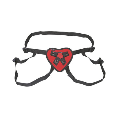 Red heart-shaped strap on harness with adjustable black straps and metal rings for secure fit.