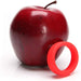 Bright red soft silicone c-ring displayed next to a shiny red apple on a white background.