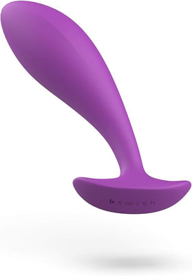 Purple silicone prostate massager with tapered head and flared base for comfortable, secure wear.