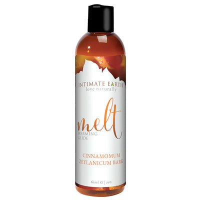 Bottle of Intimate Earth Melt Warming Glide with natural cinnamon bark extract for a gentle warming sensation.