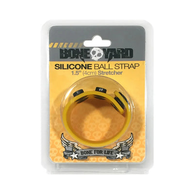 Yellow Boneyard silicone ball strap stretcher with adjustable snaps in retail packaging.