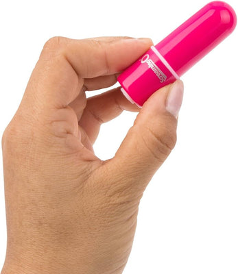 Hand holding a compact, bright pink bullet vibrator with a smooth, rounded design.