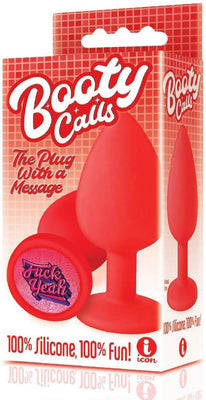 Red silicone butt plug with "Fuck Yeah" message on the base, packaged in a red box labeled Booty Calls.
