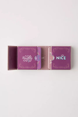 The Naughty and Nice Dates Kit with two purple card holders labeled Naughty and Nice inside a fold-out box.
