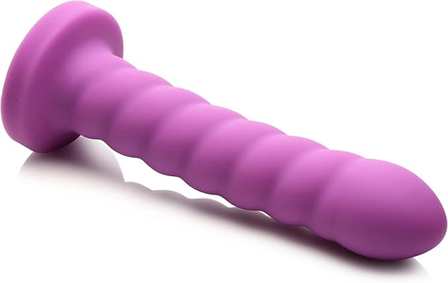 Magenta silicone personal massager with soft swirl texture and rounded tip, USB rechargeable and waterproof design.