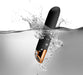 Black and rose gold waterproof vibrator submerged in water with splash and bubbles around it.