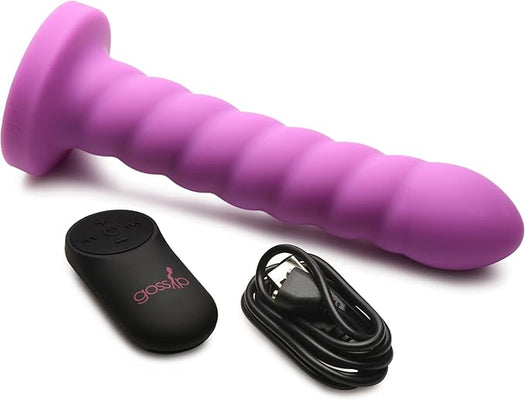 Magenta silicone swirl textured adult toy with remote control and USB charging cable on white background.