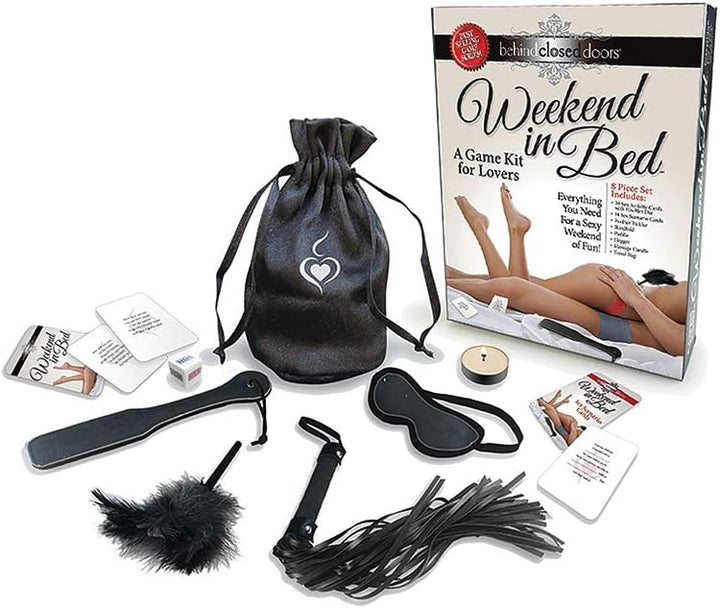 Weekend In Bed Game Kit with cards, dice, feather tickler, blindfold, paddle, flogger, massage candle, and storage bag displayed.