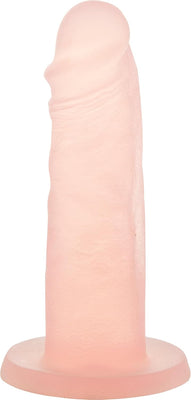 Peach-colored silicone dong with realistic texture and strong suction base for versatile use.