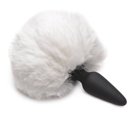Soft white fluffy bunny tail attached to a sleek black silicone base plug for interchangeable use.