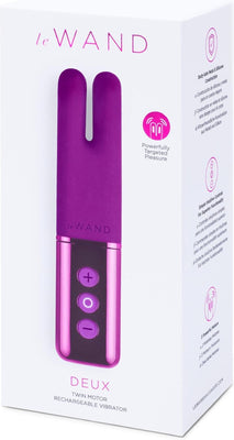 Le Wand Deux twin motor rechargeable vibrator in purple with easy control buttons on white packaging box.