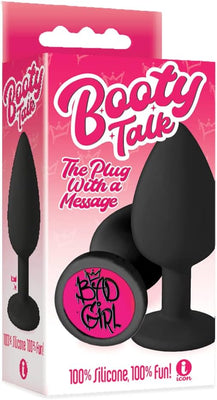 Black silicone butt plug with "Bad Girl" message on the base, packaged in pink "Booty Talk" box.