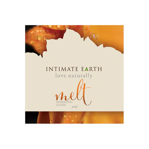 Intimate Earth Melt Warming Glide sample packet with natural warming formula and orange floral background.