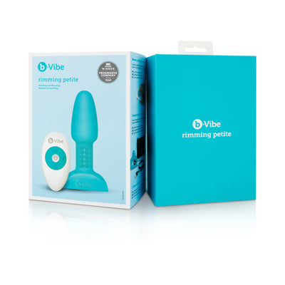 B-Vibe Rimming Petite Plug in turquoise with wireless remote control and packaging box on white background.