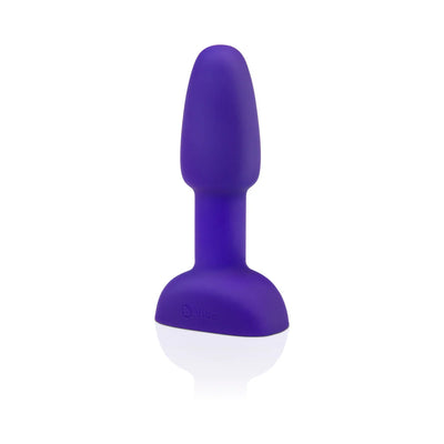 Compact purple silicone vibrating rimming plug with a tapered tip and wide base for comfortable beginner use.