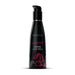 Black bottle of Wicked Sensual Care Cherry flavored water-based intimate lubricant with pump dispenser and cherry graphic.
