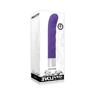Purple curved vibrator with textured silver base in white packaging labeled Evolved Spark with 10 functions and turbo mode.