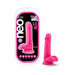 Pink 6-inch Neo Elite silicone dual density dildo with balls and suction cup base next to its retail packaging.