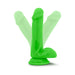 Bright green silicone dildo with suction cup base shown in multiple angled positions on white background.