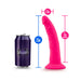 Bright pink 7.5-inch silicone dildo with suction base shown next to a soda can for size comparison.
