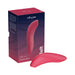 We-Vibe Melt clitoral suction stimulator in pink silicone with its branded packaging box on a white background.