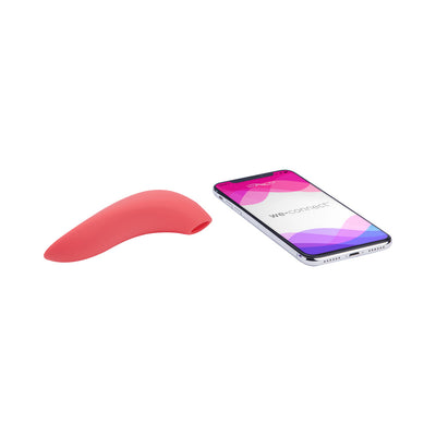 Pink We-Vibe Melt clitoral stimulator next to smartphone displaying We-Connect app interface on white background.