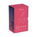We-Vibe Melt clitoral stimulator packaging in pink and navy with product features and line art of a couple.